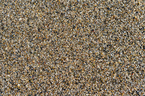Background of coarse sand of Almeria beach, Spain