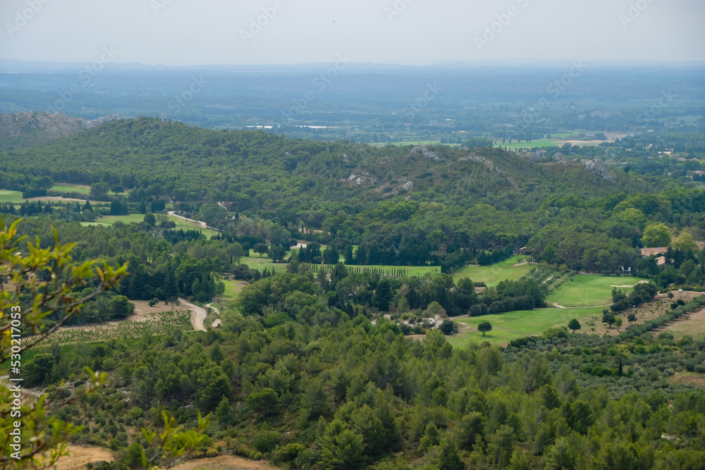View of the golf courses from Les Baux-de-Provence, France. Dry summer season 2022.