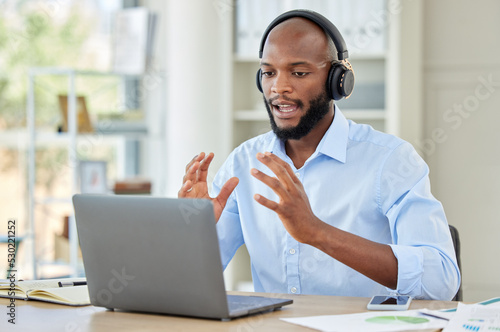 Black man, laptop and call center employee talking, training and in customer service, help and contact us support. Crm consulting office worker, receptionist or telemarketing communication consultant
