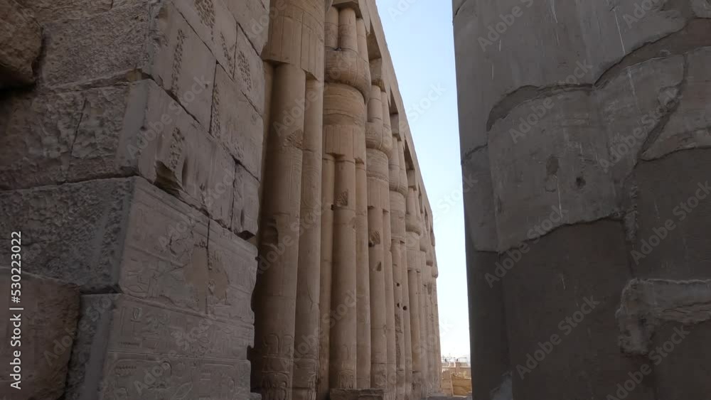 Hand-held Shot Showing The Full Stature Of The Highly Detailed Pillar Holding Up The Luxor Temple, Egypt Hand-held Shot Showing The Full Stature Of The Highly Detailed Pillar Holding Up The Luxor Temple, Egypt