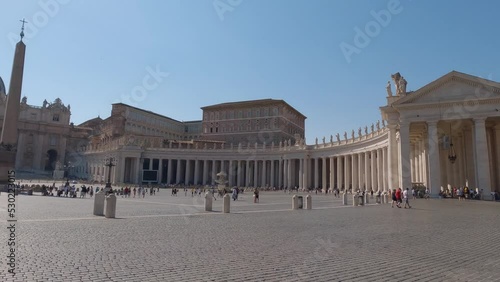 Left Pan Revealing The St Peter's Basilica With Crowds Of Tourists Admiring The Views Infront Of The Church photo