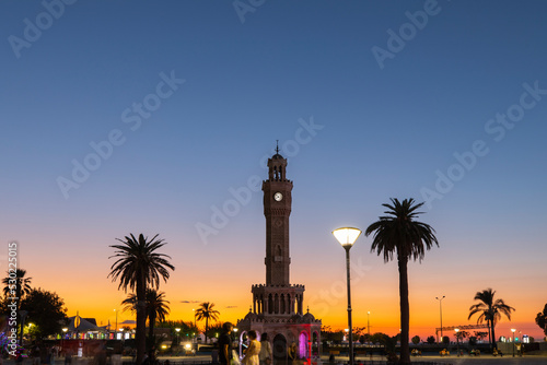 Izmir Clock Tower in the Sunset Lights, Konak City Center, Izmir Turkey photo