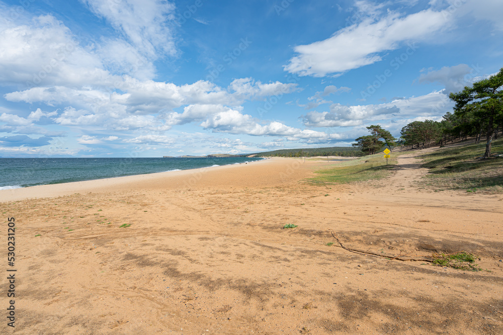 Baikal Lake at summer. Panoramic view on the sandy beach of Olkhon Island Baikal Lake at summer. Panoramic view on the sandy beach of Olkhon Island