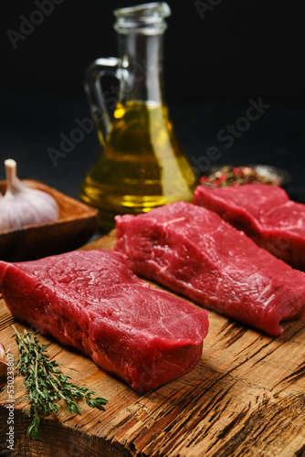 Closeup view of raw boneless strip steak loin on cutting board