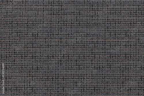 A rug made of plastic straw, as a background or texture. Plastic recycling.