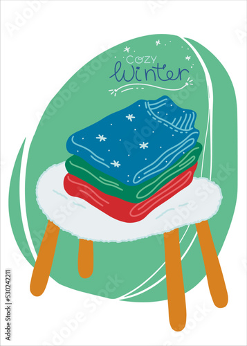 A stack of warm knitted sweaters for the cold season. The sweaters are folded over a fluffy cozy chair. Design element. Vector illustration in a flat style.