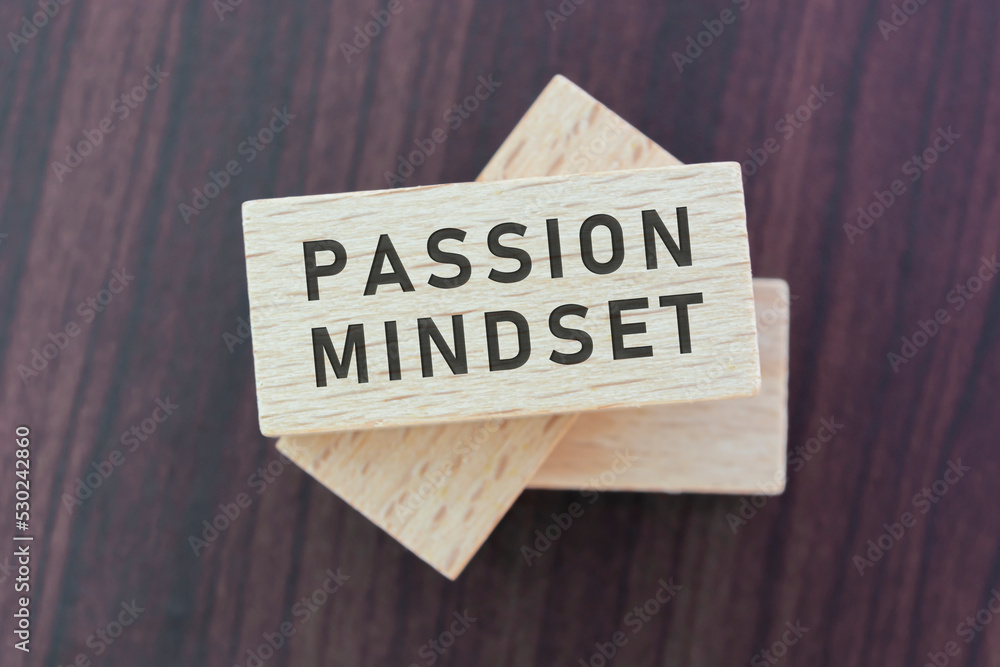 Passion mindset word on wooden block with wooden background. Passion mindset word on wooden block with wooden background.