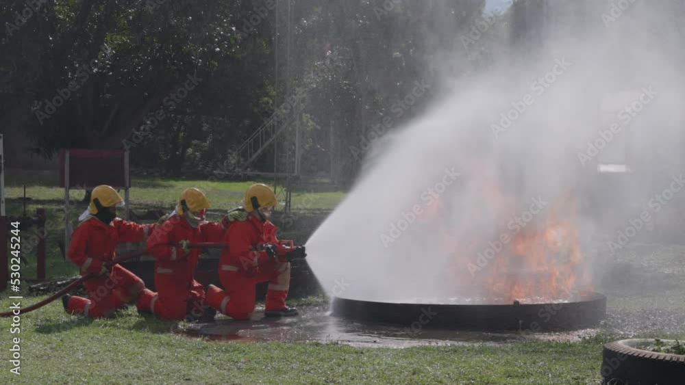 Firefighters wearing helmets with fire safety equipment Use Twirl