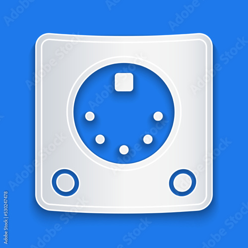 Paper cut Drum machine icon isolated on blue background. Musical equipment. Paper art style. Vector