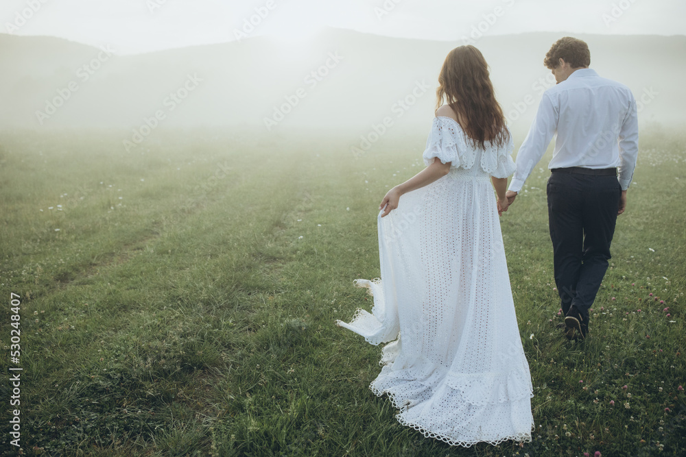 Beautiful wedding couple in nature. Wedding. Bride and groom on their wedding day. High quality photo