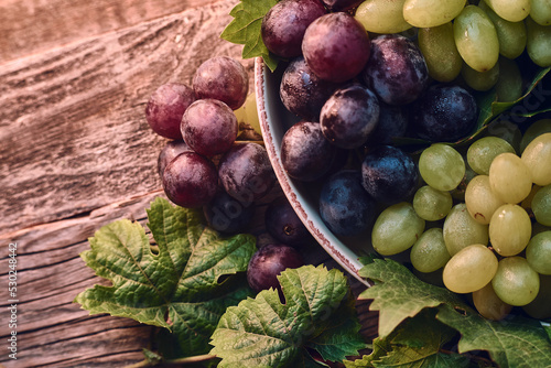 Tasty Grapes on Wooden table. High quality photo