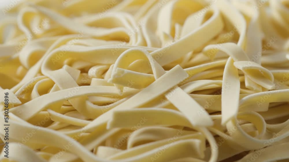 a bunch of raw pasta spins in a circle a bunch of raw pasta spins in a circle