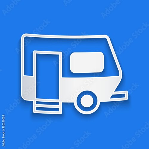 Paper cut Rv Camping trailer icon isolated on blue background. Travel mobile home, caravan, home camper for travel. Paper art style. Vector