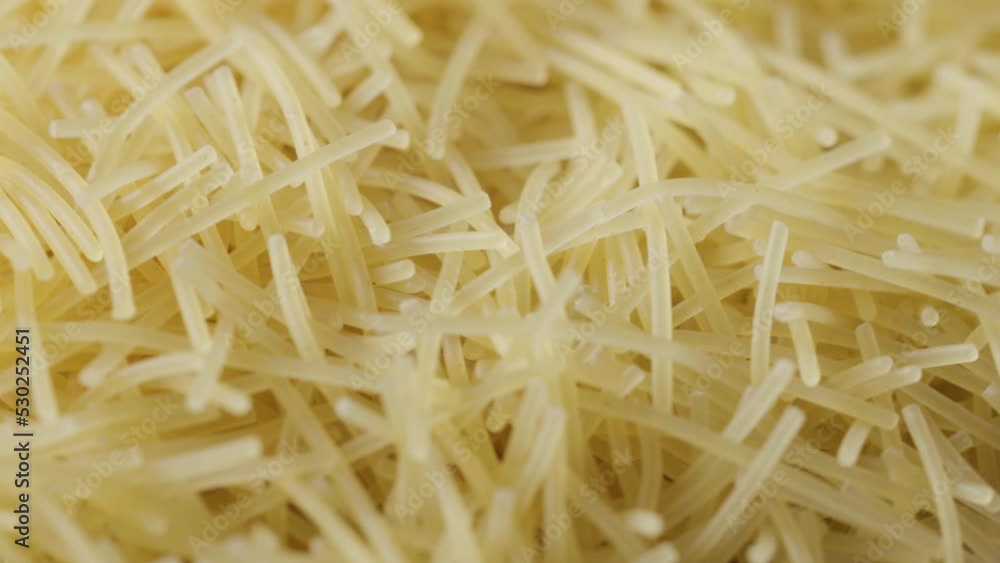 a bunch of raw pasta spins in a circle a bunch of raw pasta spins in a circle