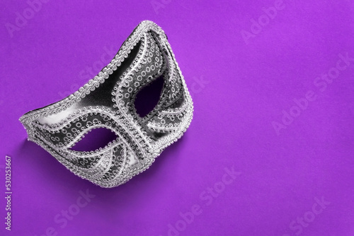 Mask on purple background