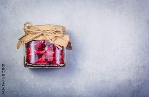 Obraz na płótnie Homemade sundried tomatoes on a gray background. Dried tomatoes in a jar copy space w salonie