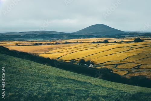 Endless fields of emerald grass on a hills. Harsh and beautiful Irish landscape. Natural wallpaper. Impressive scene