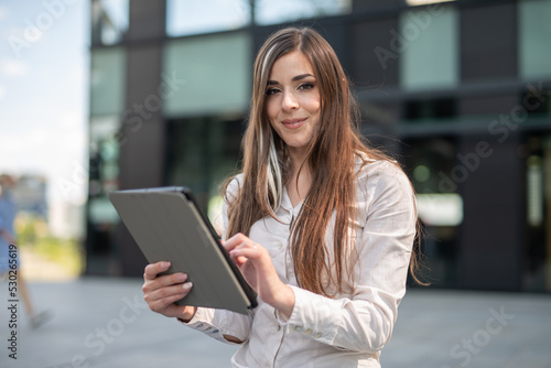Free Download Woman using her tablet outdoor - GFXLoad
