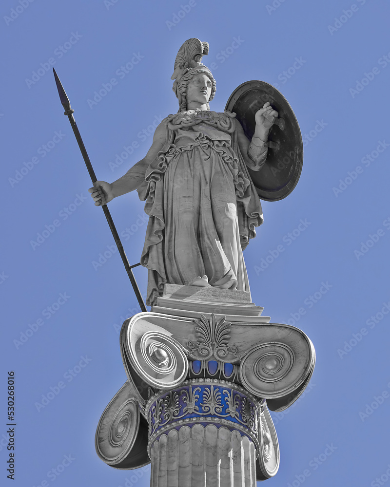 Athena statue, the ancient Greek goddess of wisdom and science, on a Corinthian style column with blue sky background. Athens, Greece. Filtered image. Athena statue, the ancient Greek goddess of wisdom and science, on a Corinthian style column with blue sky background. Athens, Greece. Filtered image.