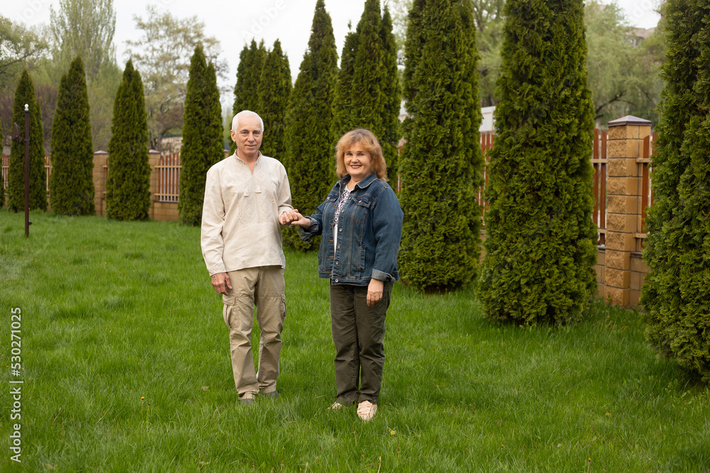Beautiful senior couple in love outside in autumn or summer nature Beautiful senior couple in love outside in autumn or summer nature