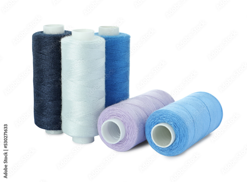 Many different colorful sewing threads on white background Many different colorful sewing threads on white background