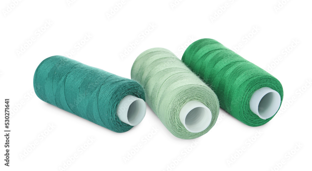 Different colorful sewing threads on white background Different colorful sewing threads on white background