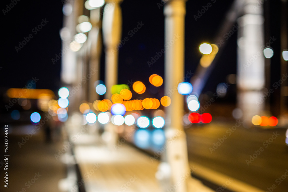 Blurry night street with bokeh, night lights of the big city