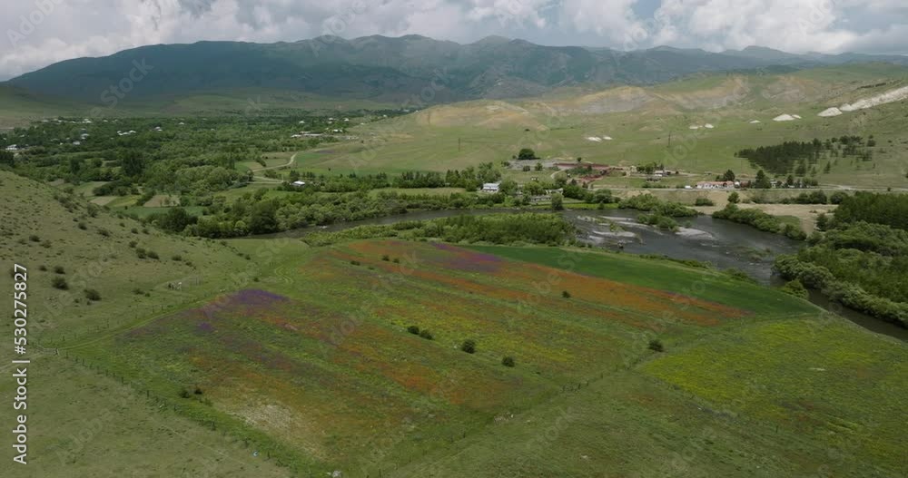Scenic Green Valley Landscape With A Small Town Outside Aspindza In Georgia. - Drone Shot Scenic Green Valley Landscape With A Small Town Outside Aspindza In Georgia. - Drone Shot