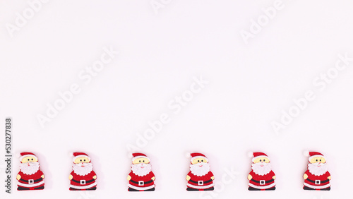 Santa Clous stickers on bottom side on white copy space background. Flat lay