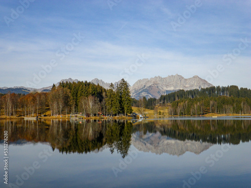 lake and mountains with perfect reflection on a cold autumn morning