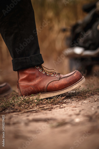 Man in old brown boots. Wallpaper