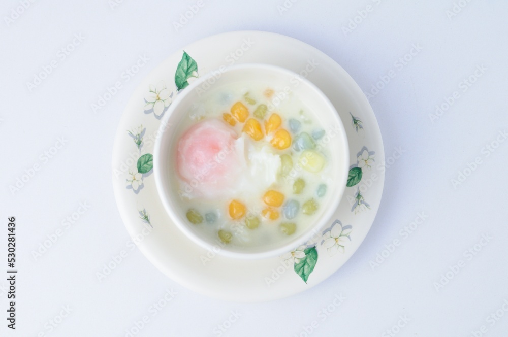 rainbow glutinous rice balls with sweet eeg on white background.Thai traditional dessert rainbow glutinous rice balls with sweet eeg on white background.Thai traditional dessert