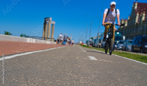 A cyclist on a bike path. Cycling on a clear day.