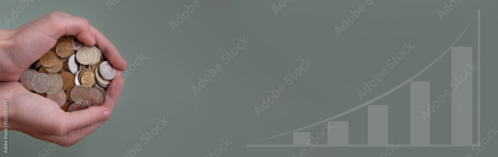 Banner on a gray-green background hands holding a handful of Russian coins next to the growth chart Banner on a gray-green background hands holding a handful of Russian coins next to the growth chart