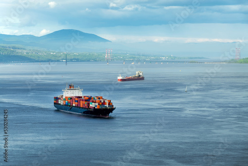 Container ships on St Lawrence river in Quebec, Canada photo