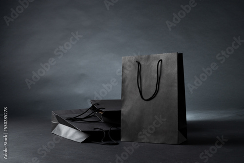 Composition of gray paper shopping bags on gray background