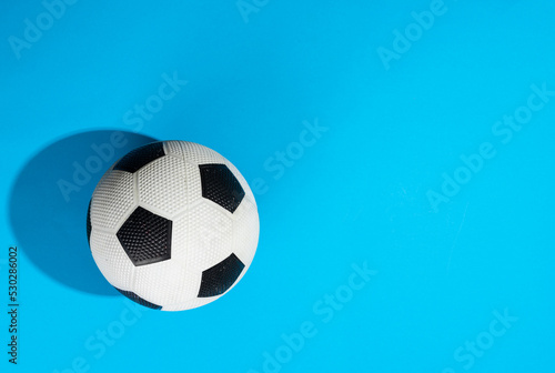 Composition of football on blue background with copy space