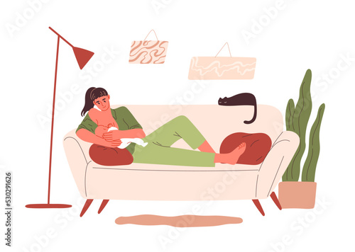 Mother breastfeeding her baby while lying on couch