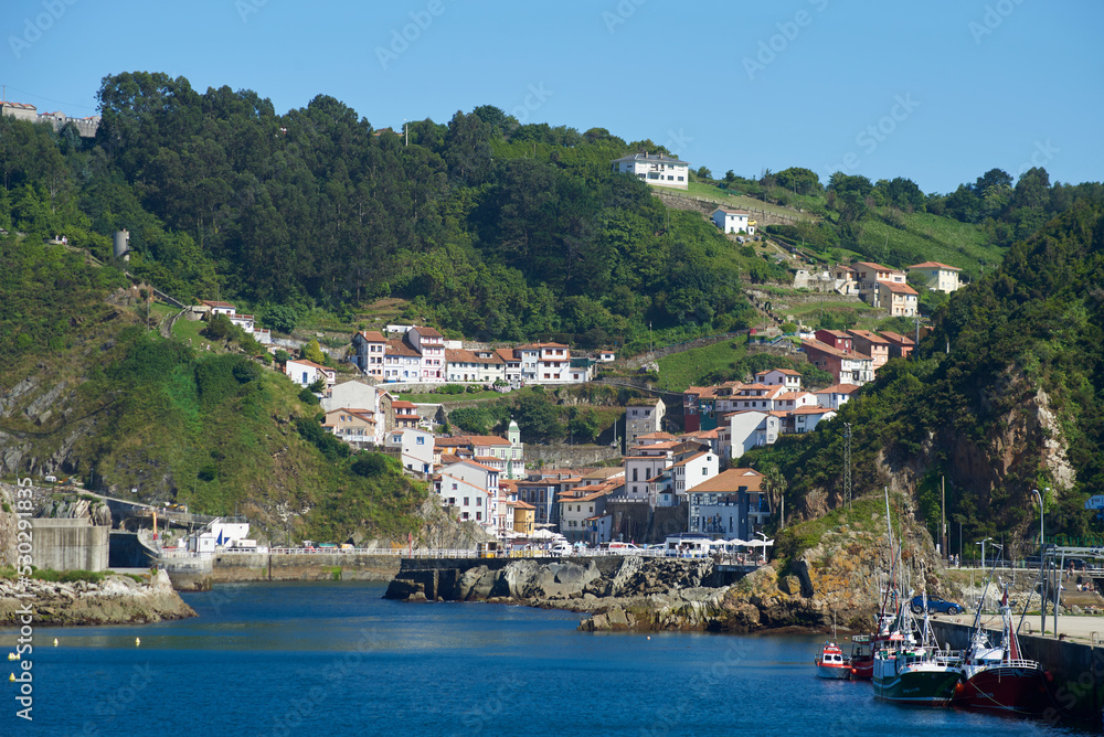 Cudillero, Asturias, Spain; June 16, 2022; A beautiful sea view on the coast of Cudillero. Cliffs of northern Spain.Lighthouse access to the port of Cudillero, Asturias.