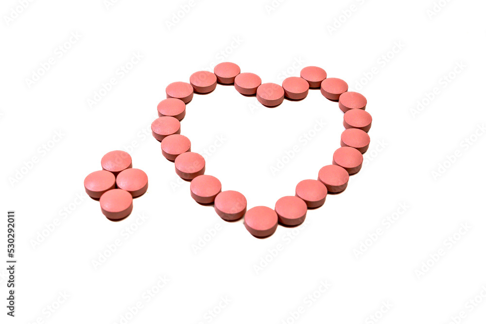 Pink pills forming a heart. Pharmacist, medicine Pink pills forming a heart. Pharmacist, medicine