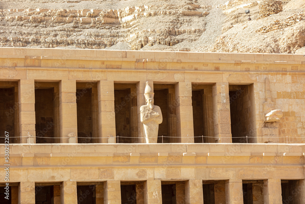 Fototapeta premium View of Hatshepsut's temple. Mortuary temple of the pharaoh of the Hatshepsut dynasty. Jeser-Jeseru is a masterpiece of ancient Egyptian architecture. The sanctuary is carved right into the rocks.
