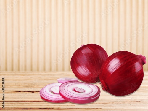 Delicious onions vegetables on the desk background