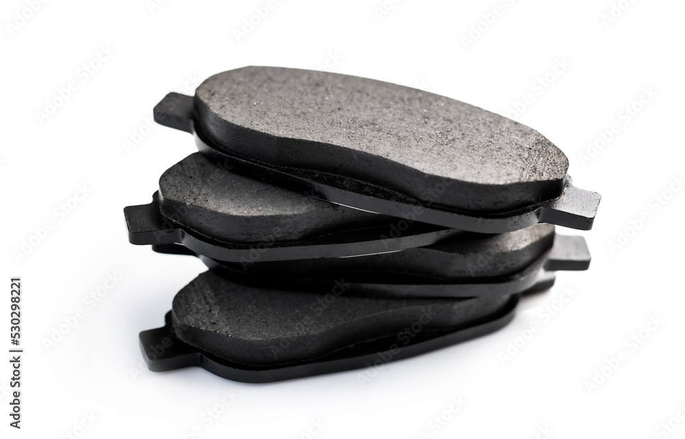 New brake pads for car transportation isolated on white background. Auto spare details for vehicle repair service New brake pads for car transportation isolated on white background. Auto spare details for vehicle repair service