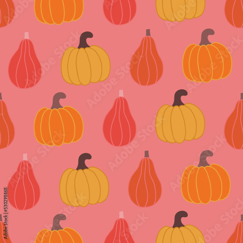 Autumn seamless pattern with colorful pumpkins on pink background