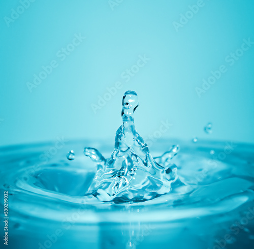 Water splash on blue background in macro