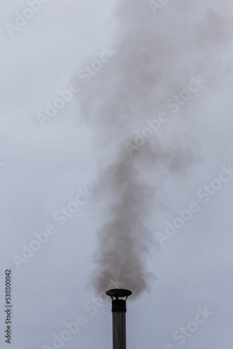 smoke from a chimney against the sky