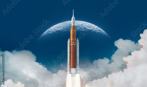 Fototapeta Naklejka Na Ścianę i Meble -  SLS space rocket in sky with clouds. Mission to Moon. Spaceship launch from Earth. Orion spacecraft. Artemis space program to research solar system. Elements of this image furnished by NASA