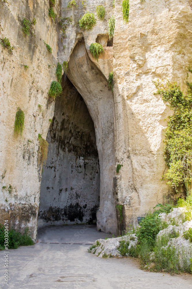 View of the Ear of Dionysius. It is an artificial cave located in the ancient stone quarry called latomia del Paradiso, under the Greek Theater of Syracuse, in Sicily, Italy.