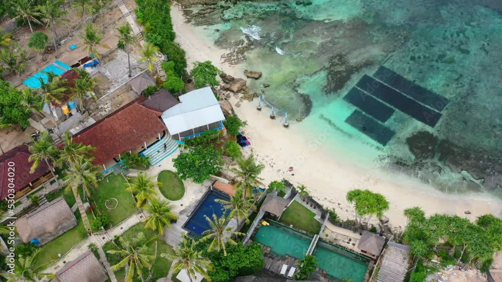 pristine white sand at Secret Point Beach in Nusa Ceningan Bali on sunny day, aerial top down pristine white sand at Secret Point Beach in Nusa Ceningan Bali on sunny day, aerial top down