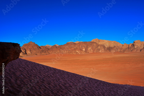 Amazing desert landscape. Beautiful landscape of desert mountains. Monolithic mountains in the central part of the desert. Wadi Rum, Jordan.